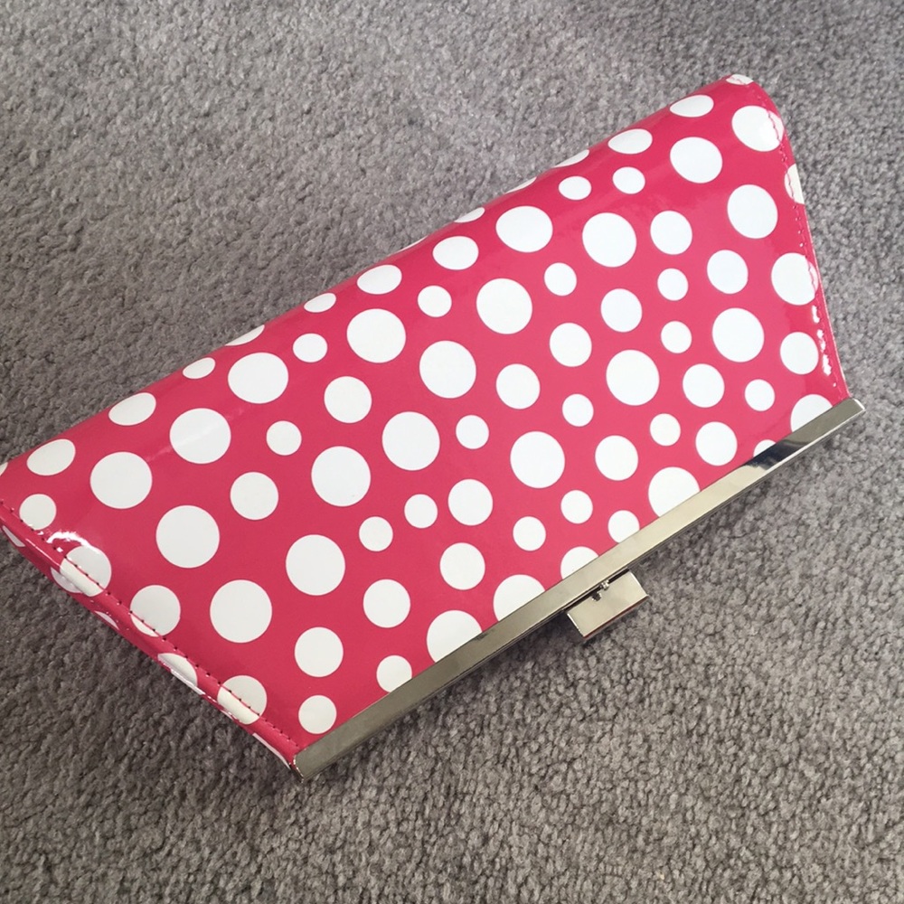 Classy pink and white hand clutch from Neimans